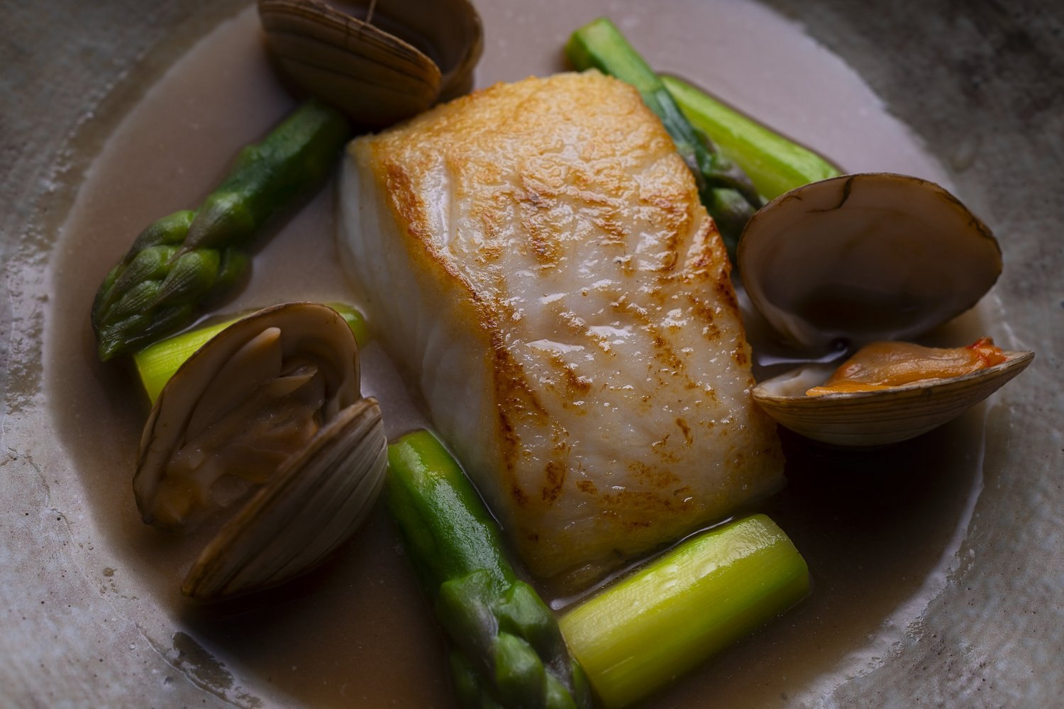 Pan-roasted cod with asparagus and clams, restaurant menu photography in Penzance