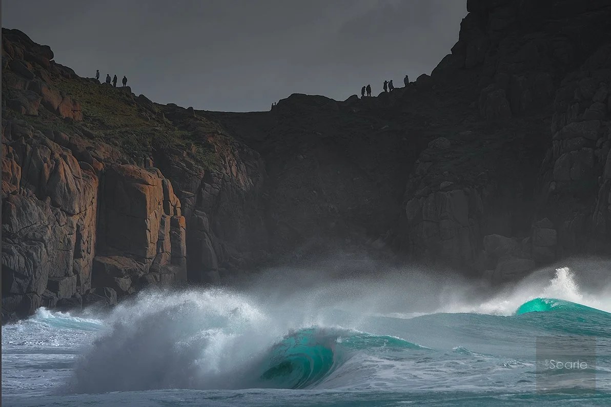 Huge turquoise waves crashing into the cliffs below the Minack Theatre, west Cornwall